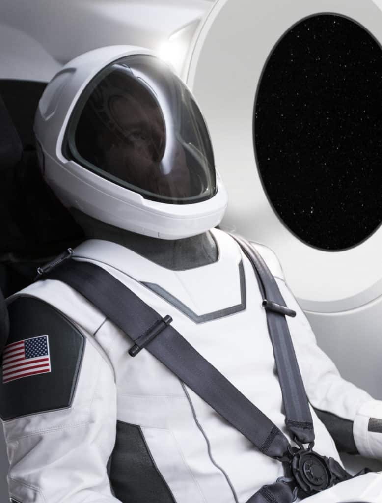 Astronaut in spacesuit inside Crew Dragon Spacecraft